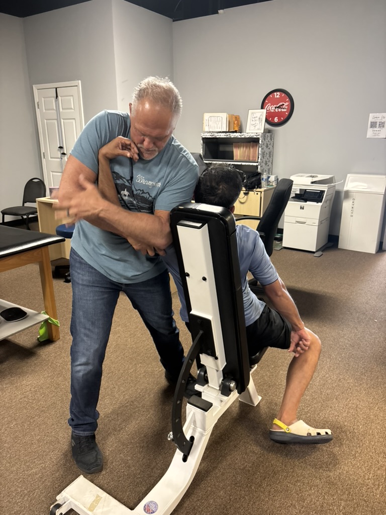 Bobby performing hands-on manual therapy
