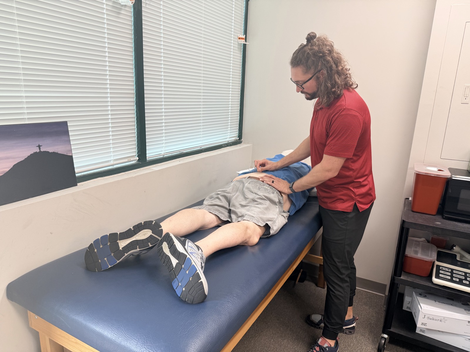 Robbie performing dry needling on a patient