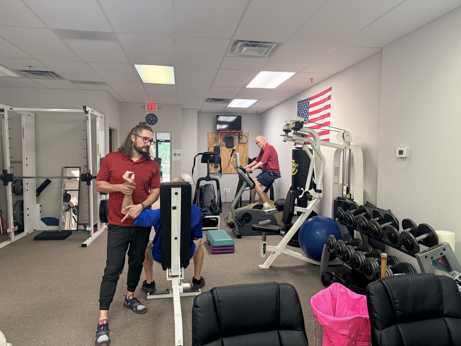 Robbie Canecchio working hands-on with a patient at the clinic